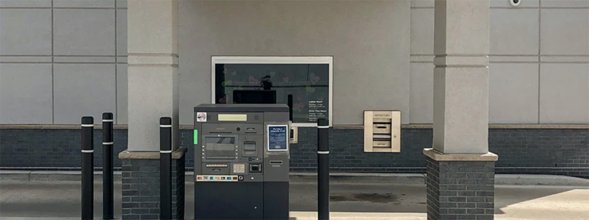 atm outside of drive through window at the bank