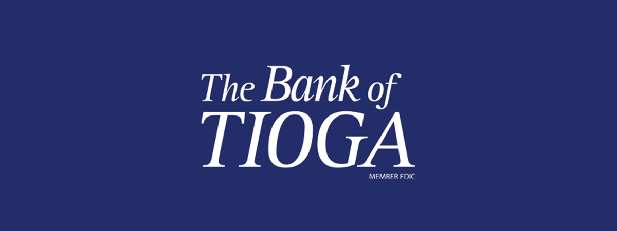 the bank of tioga logo on a blue background