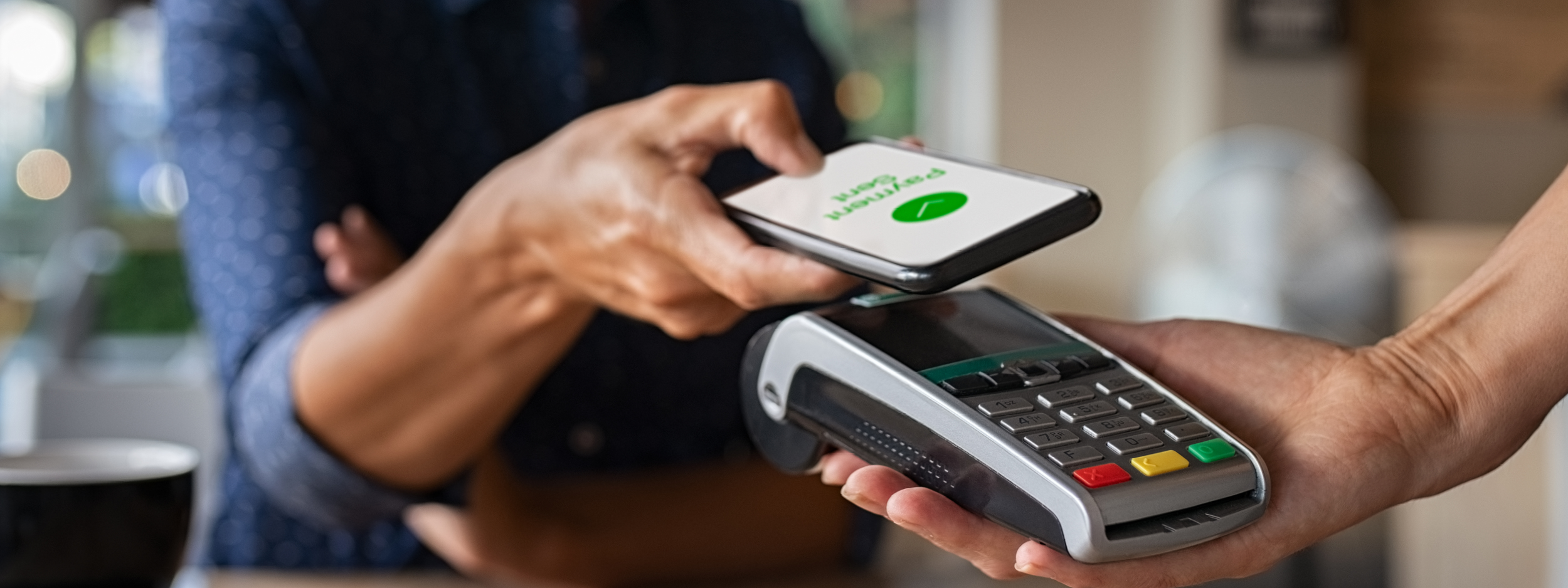 Woman paying on her phone