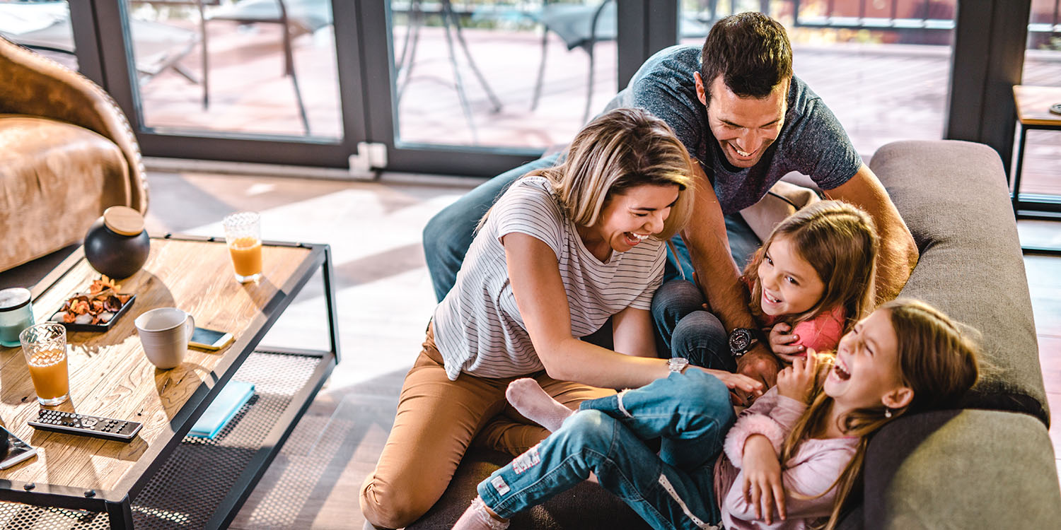 family having fun on a couch