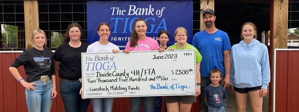 The Bank of Tioga employees gift donation to the Divide