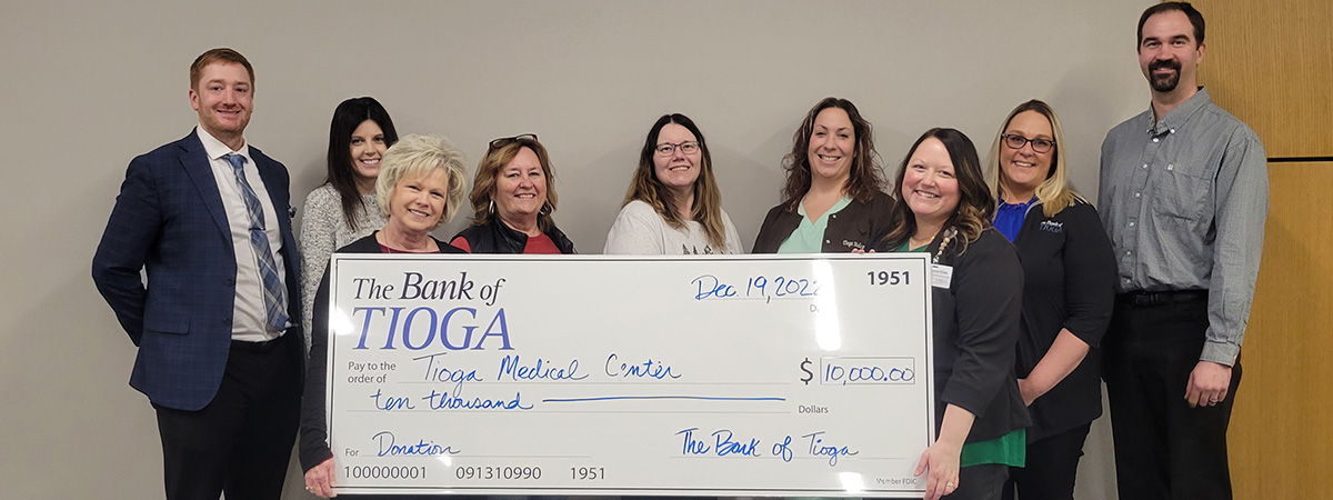 Tioga Medical Center receiving check from The Bank of T