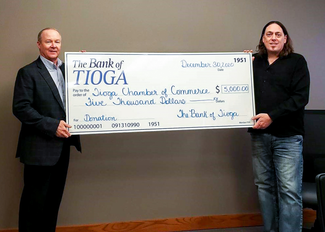 Tioga Chamber of Commerce receiving a check from The Bank of Tioga