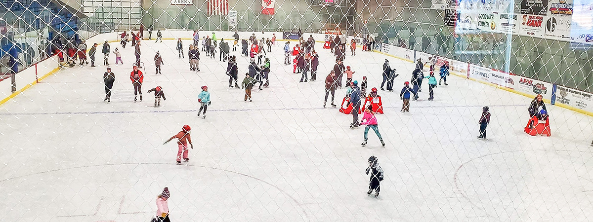 parents and children skating at the crosby ice rink