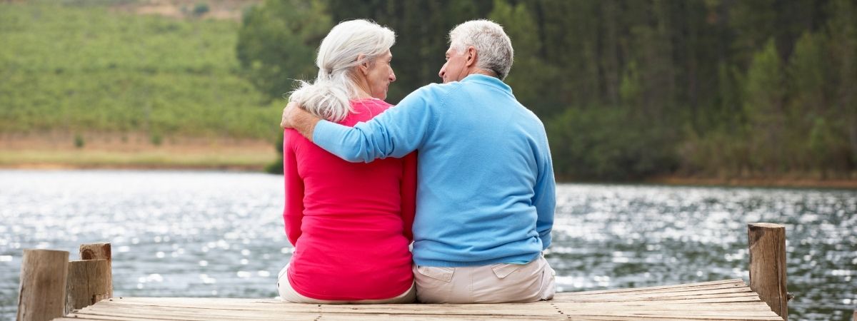 Older couple sitting on a dock