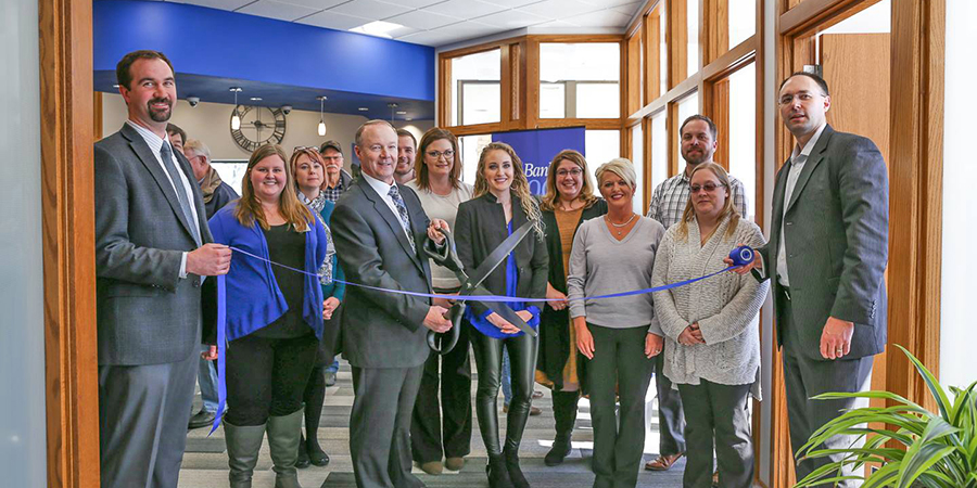 employees at a ribbon cutting